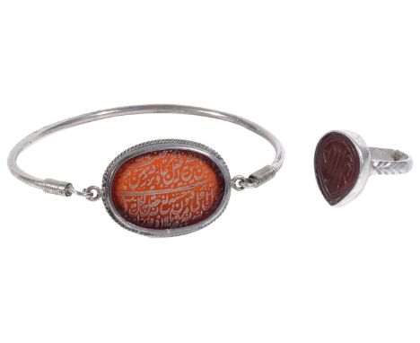 A CARNELIAN-SET RING AND BRACELET, INDIA, CIRCA 19TH CENTURY each inscribed, the ring with drop shaped bezel, the bracelet ov
