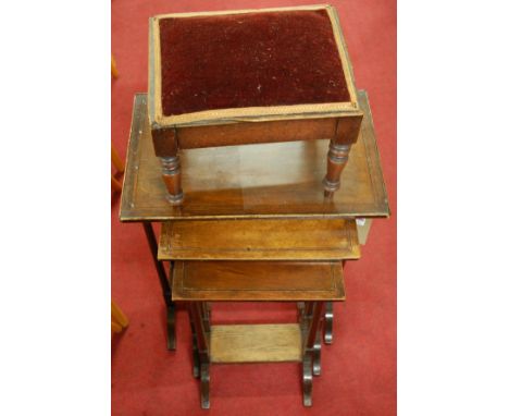 A mahogany nest of three occasional tables (one table missing); together with a Victorian mahogany low footstool ***AND A VIC