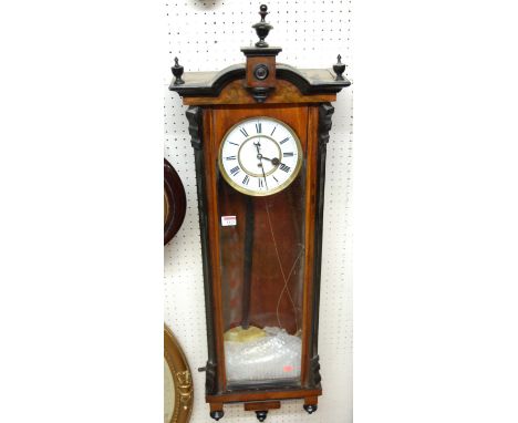 An early 20th century walnut Vienna droptrunk wall clock