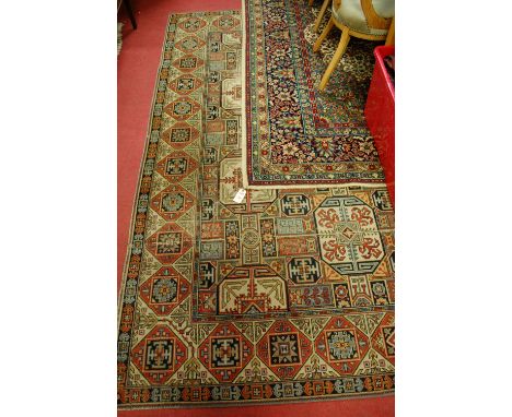 A Persian style machine-woven woollen carpet; and one other (2)