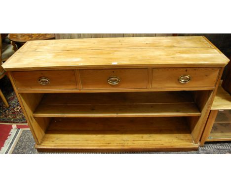 A reclaimed pine side cupboard, having three frieze drawers over open single shelf compartment, w.153cm