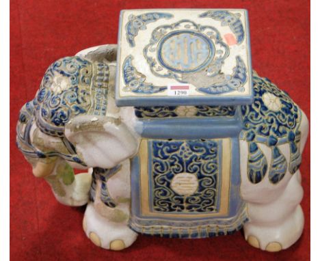 A contemporary Chinese glazed stoneware elephant seat (with losses to glazing throughout). Height 45cm.Heavy losses to glaze 
