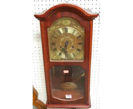 A reproduction mahogany cased droptrunk wall clock