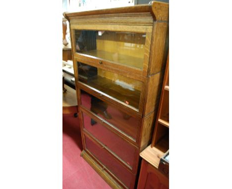 A 1930s Globe Wernicke oak five-tier stacking bookcase, having typical glazed hinged doors, w.87cm