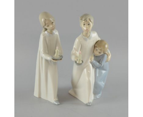 NAO figure of a young girl and a Lladro figure of a young boy with a sister holding a chamber stick No chips, cracks or resto