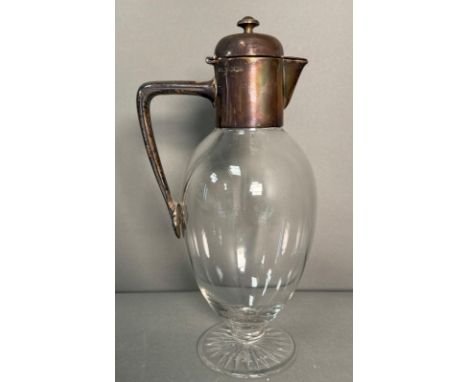 A silver mounted cut glass claret jug hallmarked for Birmingham William Goss 