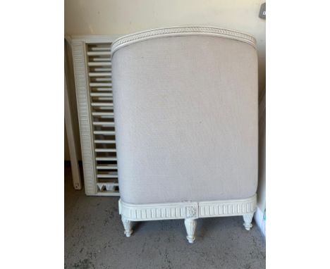 A white painted Louis style cot bed with white linen ends on scrolling carved feet with mattress, requires bolts 