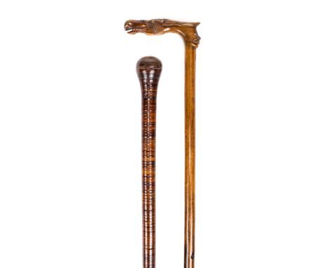 *Walking Stick. A Greek walking stick, circa 1900,  carved from olivewood the handle carved with a horse's head and a moustac
