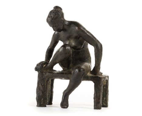 *Manner of Edgar Degas (1834-1917). Seated nude examining her right foot,  bronze, unsigned, 18 cm (7 ins) high  (1)