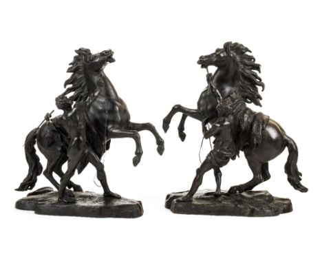 *After Guillaume Coustou (1677-1746). Pair of Marly Horse groups, 19th century,  a substantial pair of bronze figures of the 