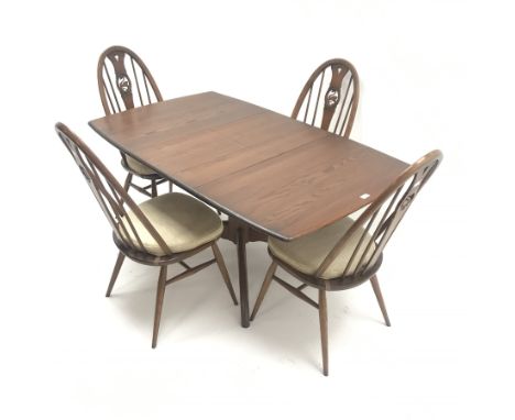  Ercol Windsor dark elm extending pedestal dining table, turned column on four supports (W149cm extended, W104cm closed, H73c