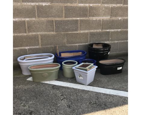 A quantity of approx. sixteen glazed ceramic planters - various shapes and sizes - Condition Report 