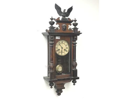  Late 19th century walnut cased Vienna style wall clock, with eagle and final pediment, twin train 'Junghans' movement striki