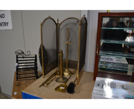A spark guard, a companion set and a brass Palmer and Co. London candlestick