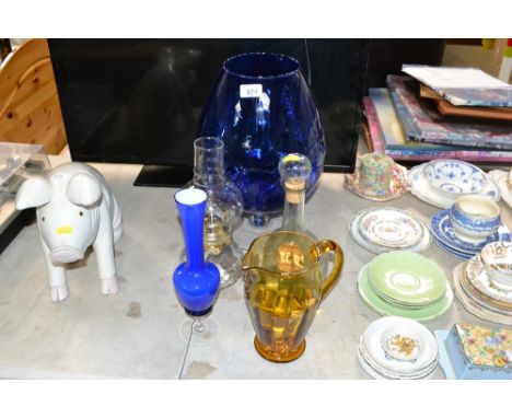A collection of glassware to include a large goblet; oil lamp etc
