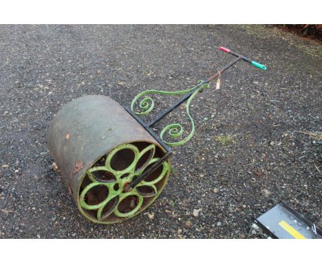 An ornate cast iron garden roller