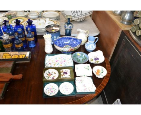 A Belleek vase, a Belleek jug, a Royal Doulton vase, a Jasperware and silver-plate mounted biscuit barrel, a Wedgewood Jasper