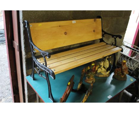 A child's metal and wooden slatted garden bench