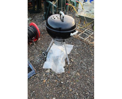 A small Webber barbeque and a quantity of tools