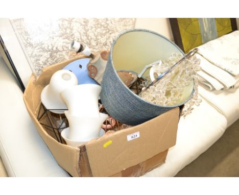 A box containing pottery table lamp and various shades