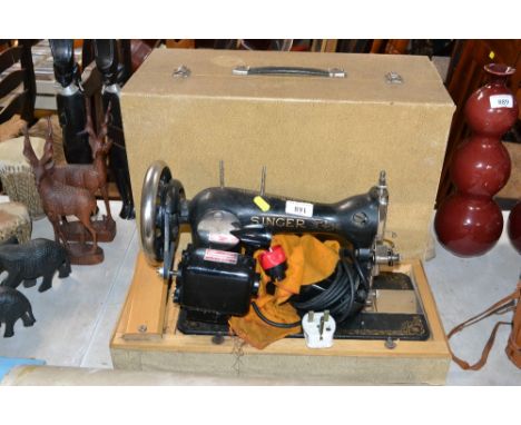 A Singer sewing machine, sold as collectors item