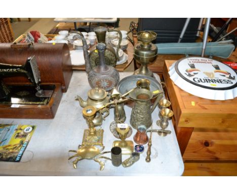 A collection of metal ware to include brass candlesticks, oil lamp, ornaments etc