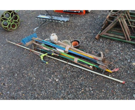 A quantity of long-handled garden tools