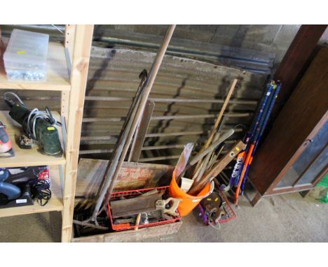 A quantity of hand tools and two long tools