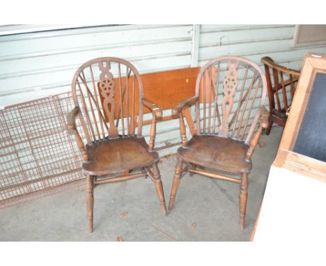 Two stick and wheel back elbow chairs together with a Myers headboard