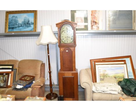 An oak long cased clock with painted dial