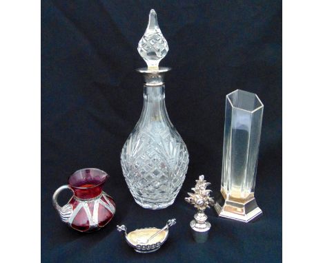 A cut glass decanter with drop stopper and hallmarked silver collar, a glass vase mounted on a hallmarked silver stand and a 