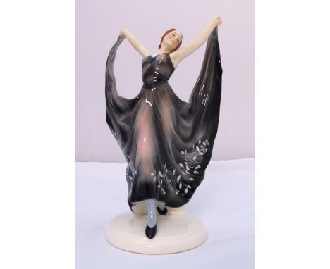Goldscheider style figurine of a dancing lady on raised circular base, 32cm (h)