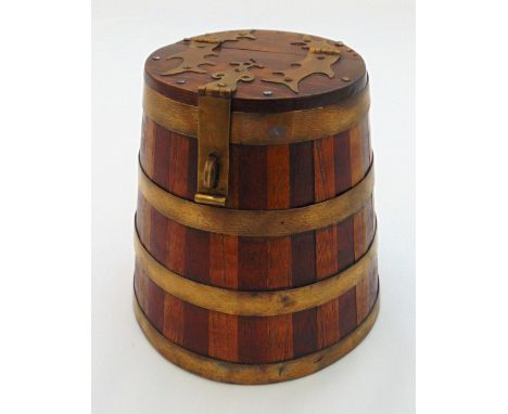 A naval brass bound, larch and teak tobacco box circa 1870 in the form of a barrel with hinged cover, 16cm (h)