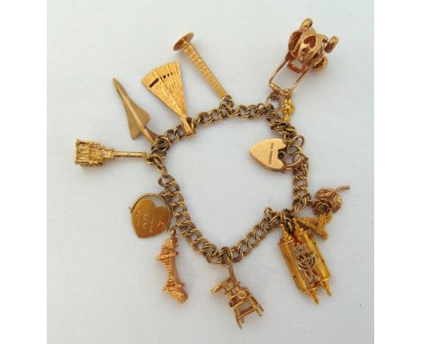 9ct gold charm bracelet with three 14ct gold charms, nine 9ct gold charms and a 9ct gold padlock clasp, approx total weight 4