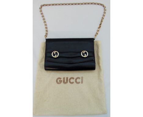 A Gucci blue leather ladies evening bag with gilded metal fancy link carrying strap