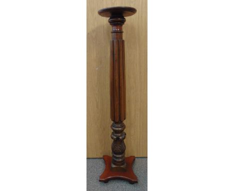 An early 20th century mahogany pedestal plant stand with carved decoration on shaped quatrefoil base, 126.5cm (h)