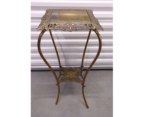 A gilt metal shaped rectangular plant stand on four scroll legs, 78 x 32 x 32cm