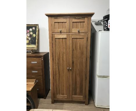 FROM THE SAME RANGE AS LOT 1 A SOLID OAK TALL KITCHEN FITTED CUPBOARD WITH PINE DRAWERS WINE RACK AND STORAGE 1M WIDE X 2.10M