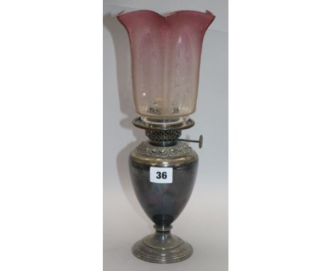 A late Victorian silver plated oil lamp, with tinted glass shade H.35cm.