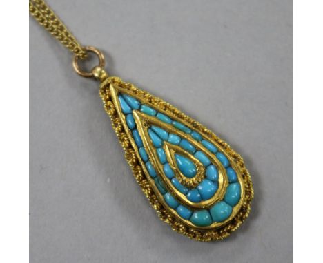 A late 19th/early 20th century Indian? yellow metal and turquoise set teardrop shaped pendant, on a gilt metal chain, 32mm.