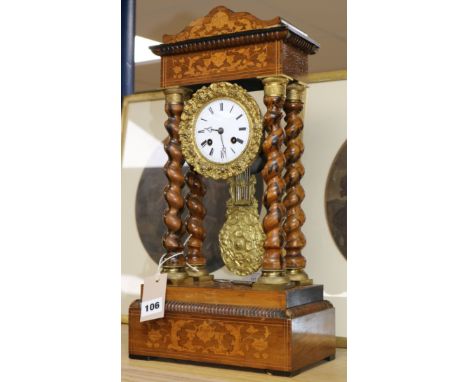 A 19th century French marquetry and rosewood portico clock 48cm.