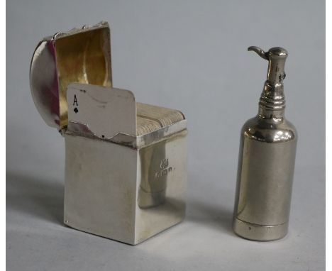 A silver miniature playing card box with hinged cover enclosing two compartments and a novelty writing companion in the form 