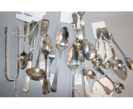 Nineteen assorted small items of flatware including, caddy spoon, sugar tongs, butter knife and sifter spoon.