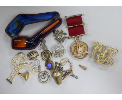 A silver gilt medallion, cased pipe and other items.