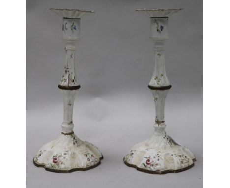A pair of 18th century English enamel candlesticks 26cm.