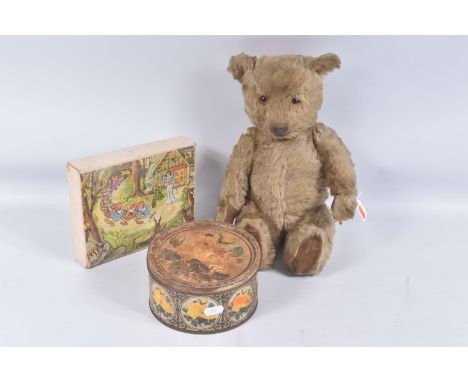 A GOLDEN PLUSH TEDDY BEAR, originally birthday is April 1957, amber and black glass eyes, shaved short muzzle with vertically