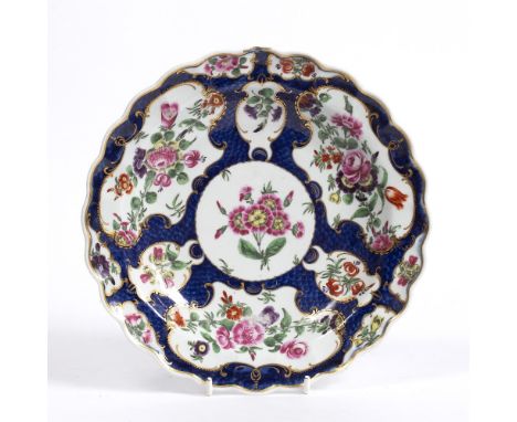 Worcester shaped circular dish late 18th Century, decorated in ground scale blue with flower blossoms, 19.5cm across