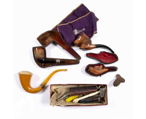 Group of Meerschaum pipes and other related pieces including a silver pipe cutter in the form of a champagne bottle