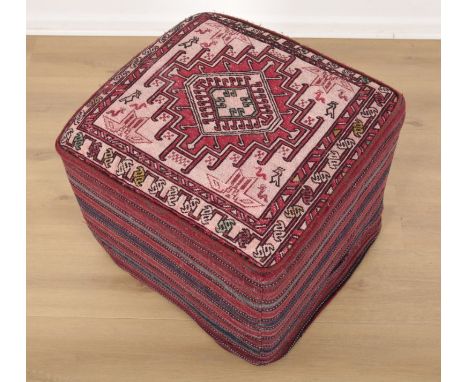 A CARPET COVERED STOOLthe top with a central floral medallion within borders and guards, 45cm high x 49cm wide x 52cm deep