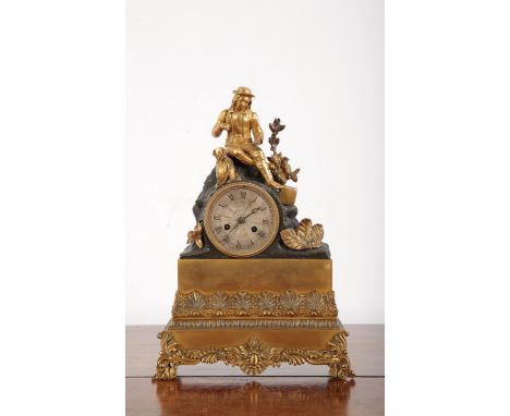 A FRENCH EMPIRE ORMOLU MANTLE CLOCKearly 19th Century, with seated Traveller cresting, the silvered dial to a two train movem